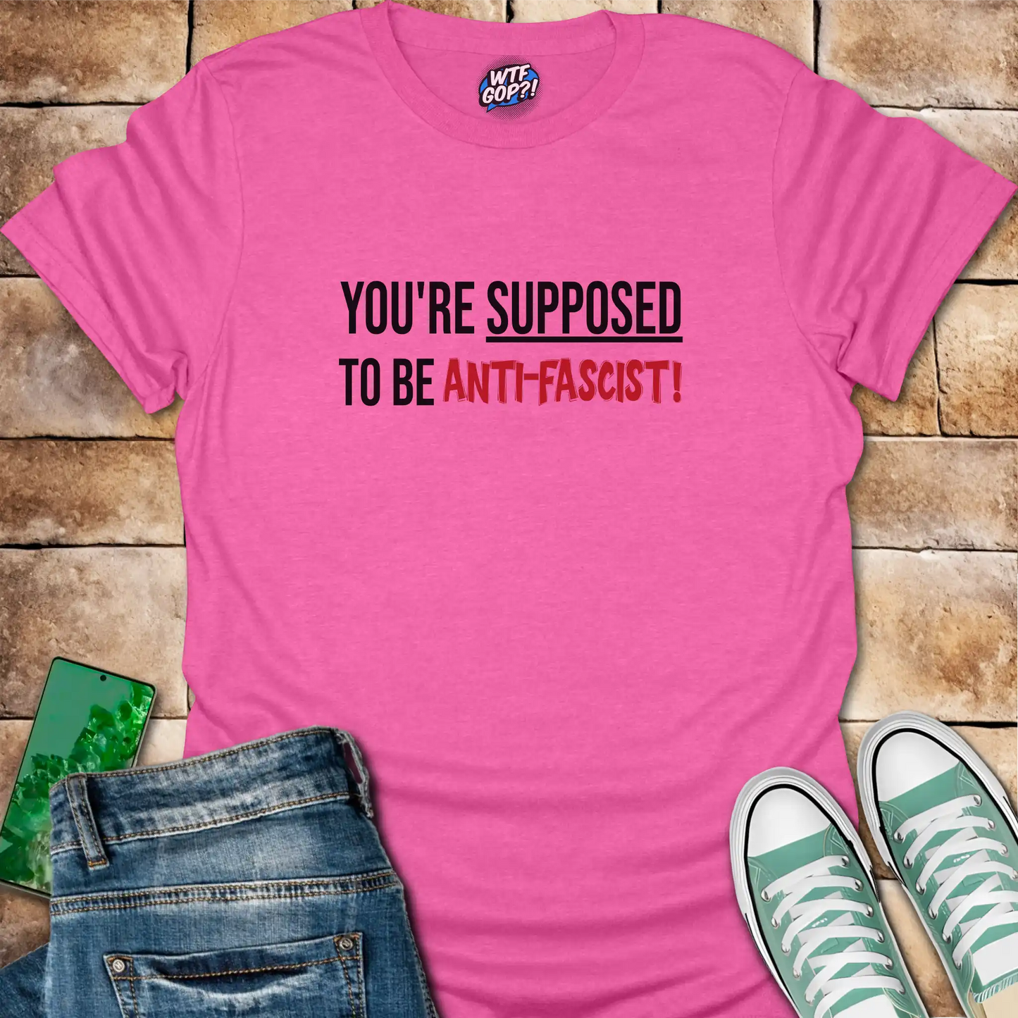 Pink Anti-Fascist T-Shirt: The phrase 'You're Supposed To Be Anti-Fascist!' in bold letters.