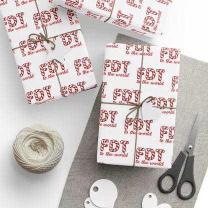 Christmas wrapping paper featuring a repeating pattern of the political text "FDT TO THE WORLD" in a classic red and white candy cane font.