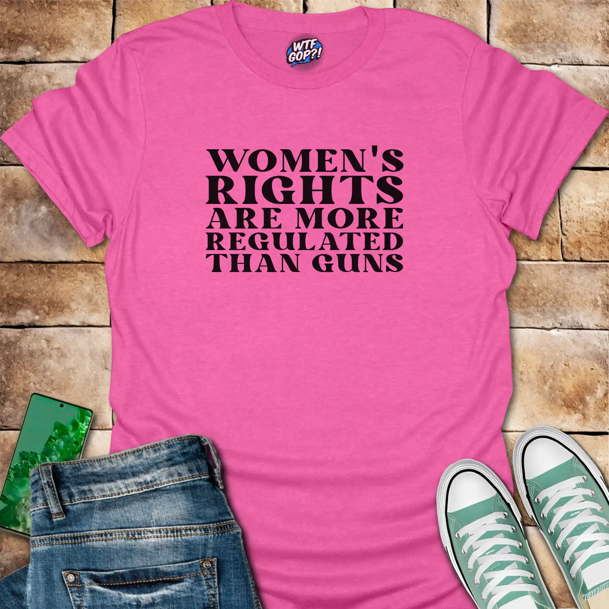 Pink Women More Regulated Than Guns t-shirt with bold political statement text