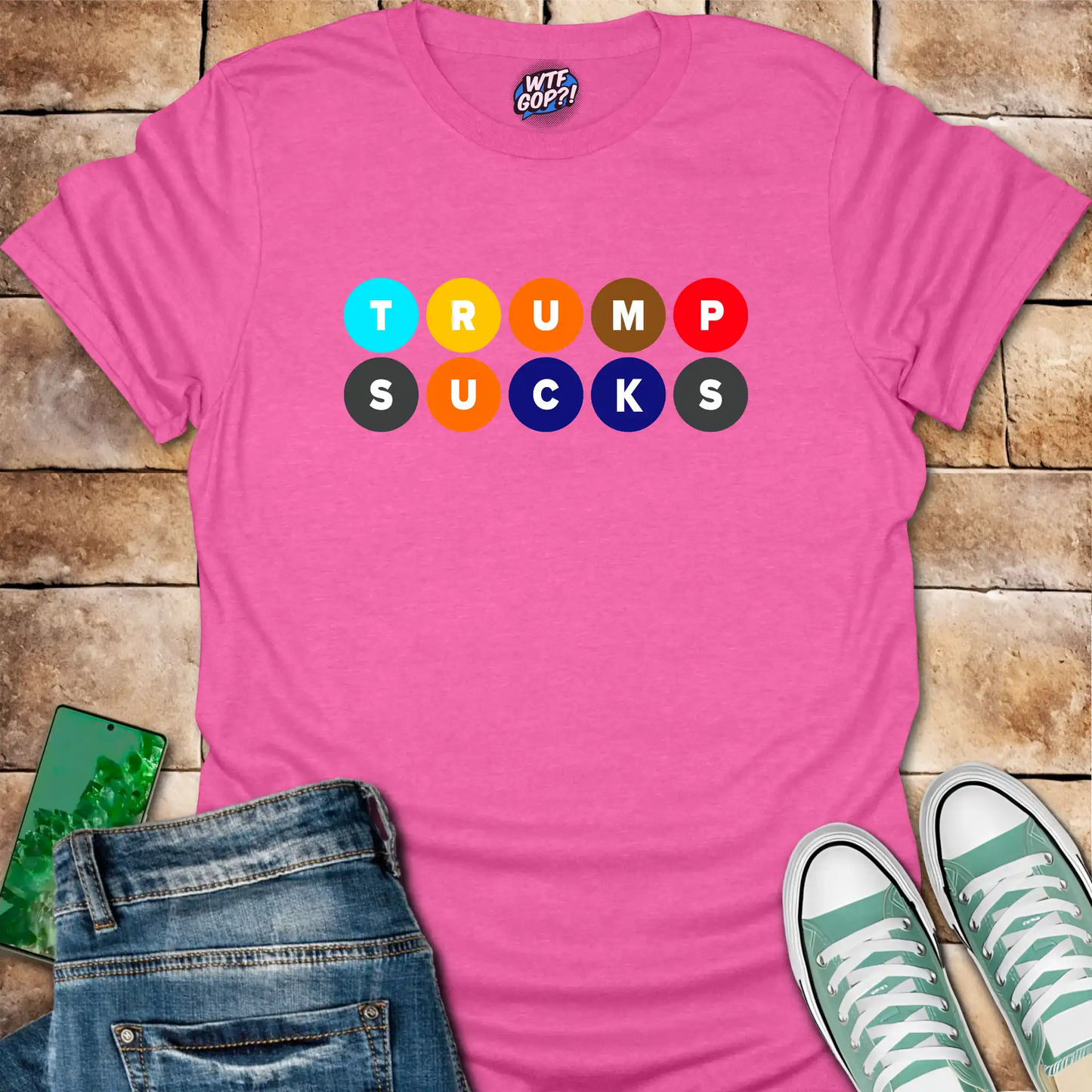Pink Trump Sucks NYC Subway t-shirt with colorful MTA-inspired circle design