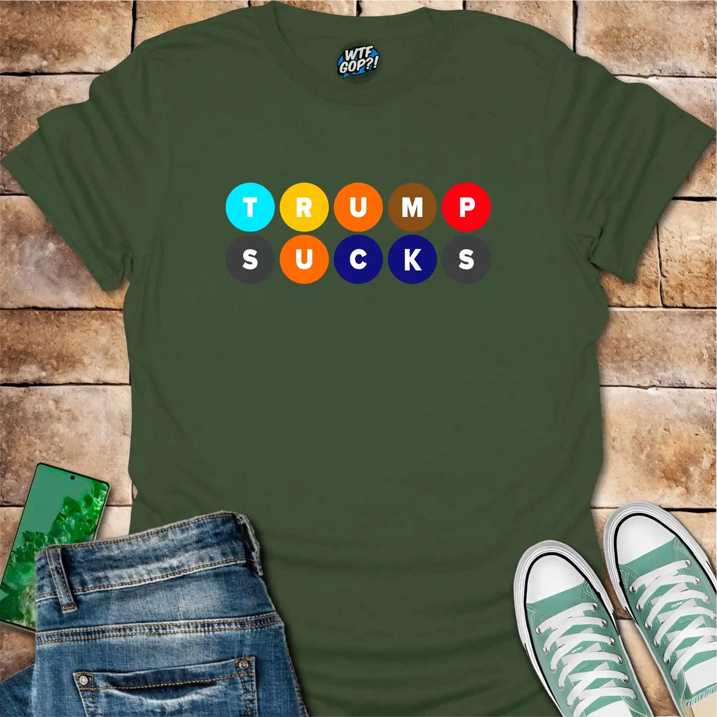 Military Green Trump Sucks NYC Subway t-shirt with colorful MTA-inspired circle design