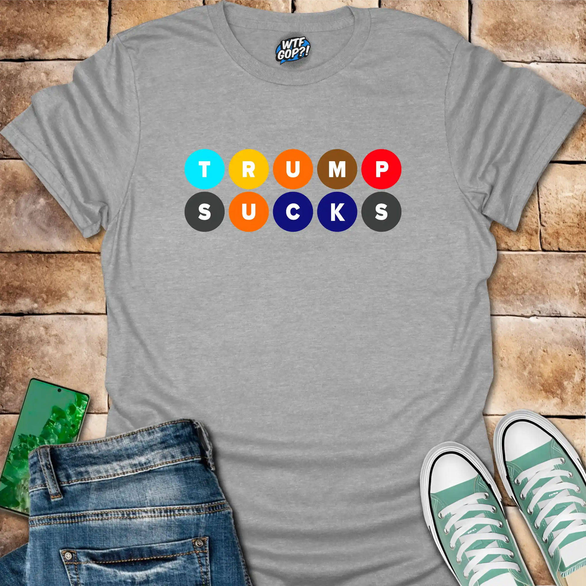 White Trump Sucks NYC Subway t-shirt with colorful MTA-inspired circle design