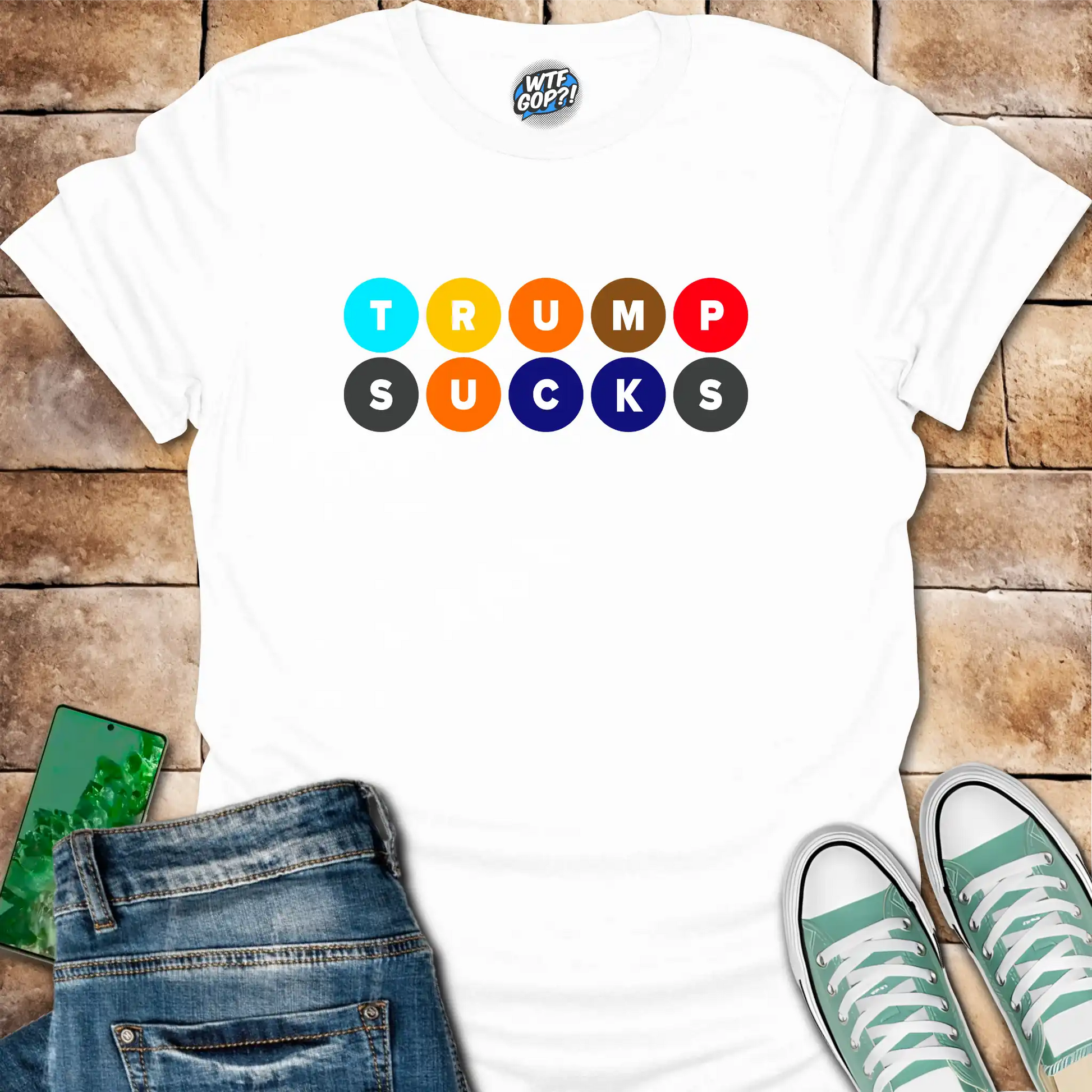 White Trump Sucks NYC Subway t-shirt with colorful MTA-inspired circle design